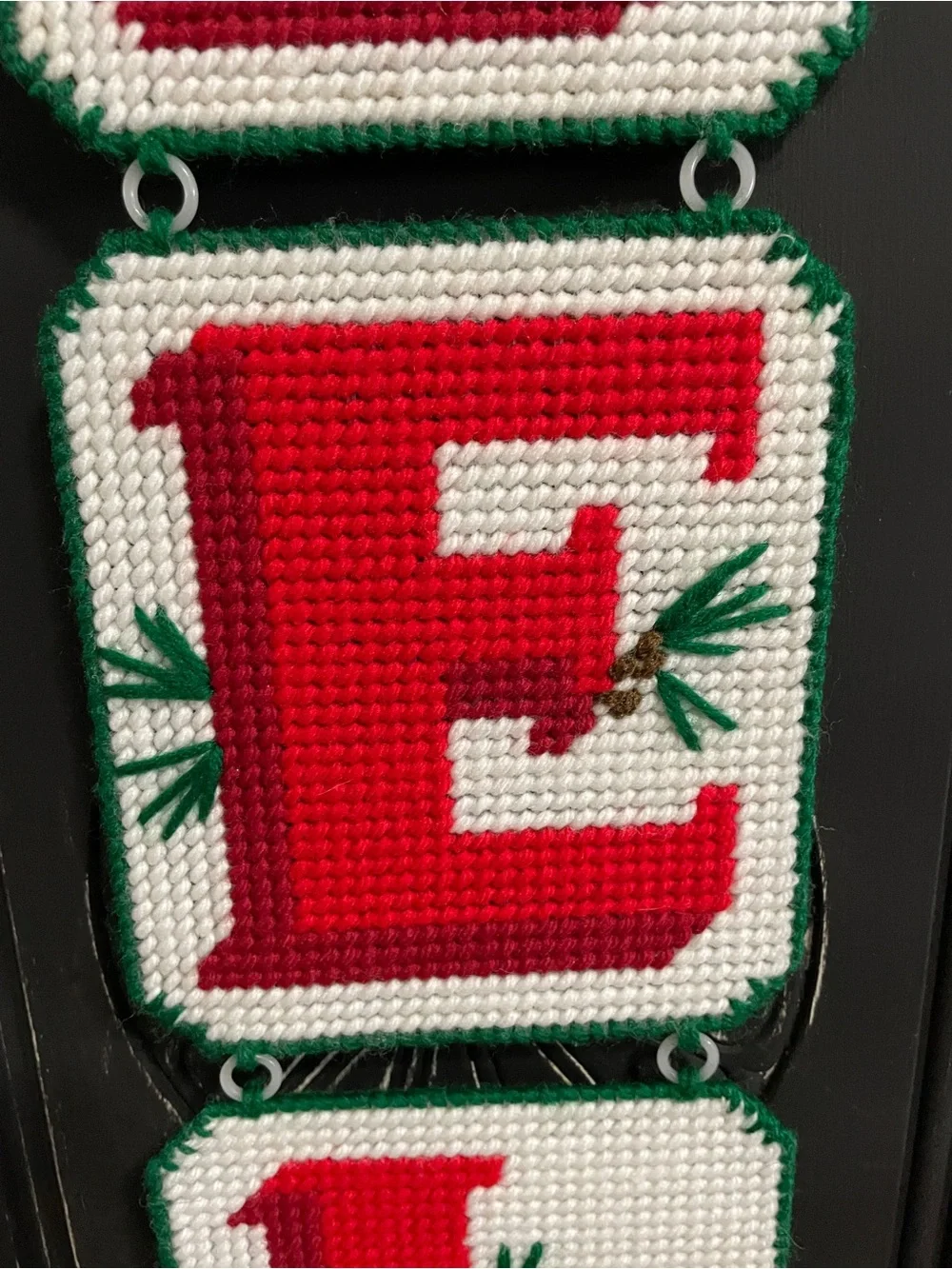 Handmade plastic canvas needlepoint NOEL Christmas hanging decoration.